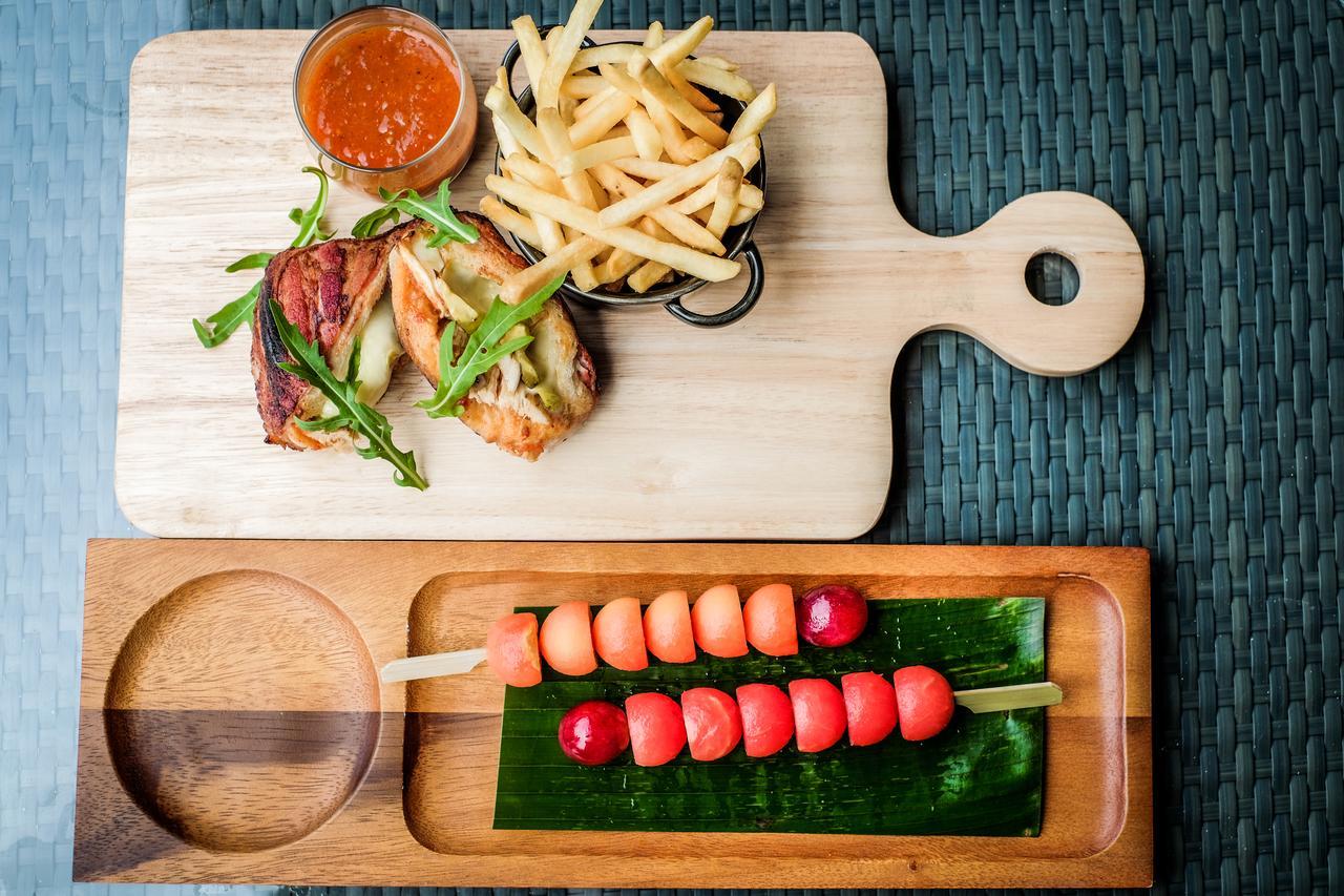 Fusion Suites Phuket Patong Exterior foto A wooden cutting board with a handle